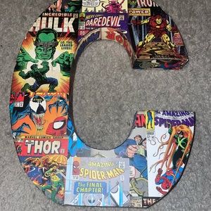 Block letter C - comic book covered - super heroes